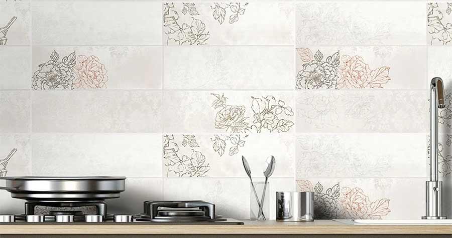 Floral wall tiles behind a stove and table